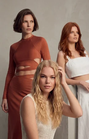 Three models with brunette, red and blonde hair