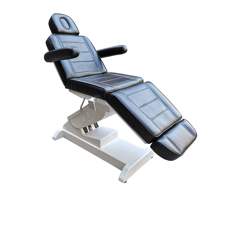 Deluxe electric beauty bed in black upholstery on a white powered base, part reclined