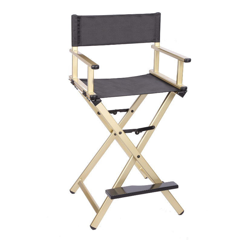 Caitlin make up chair, a tall folding director style chair with a gold frame and black mesh seat