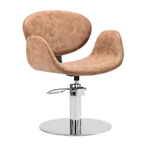 Tan leather styling chair with a rounded tub back on a chrome five star base