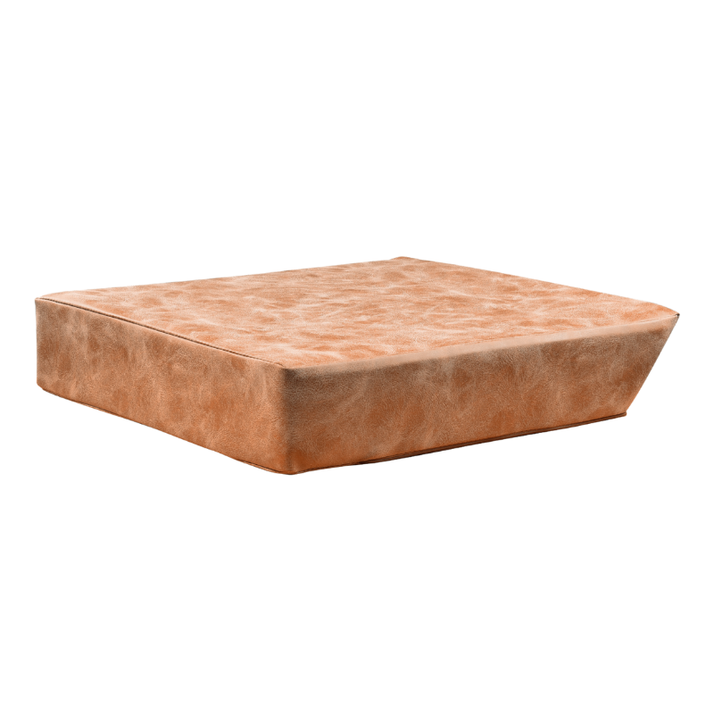 Tan leather booster cushion sized for a shampoo unit