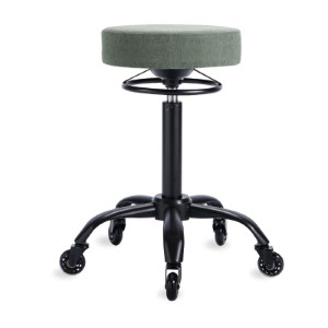 Round salon stool with a sage green seat and a footring, on a black five star base