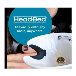 HeadBed neck rest fitted to the lip of a white basin, captioned fits easily onto any basin, anywhere