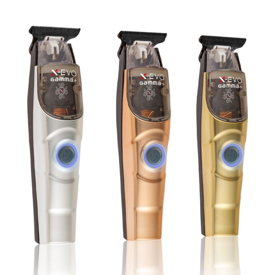 Three Gamma+ X-Evo trimmers standing side by side in matte chrome, matte rose gold and matte gold